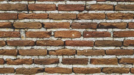 Brick wall with cement mortar close-up.の写真素材