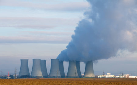Nuclear power plant by day with smokestackのeditorial素材