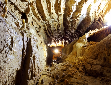 dark mystery stone cave with lightの写真素材