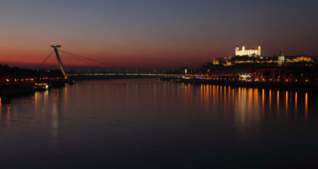 Bratislava castle and novy bridge a t sunset with reflectionのeditorial素材