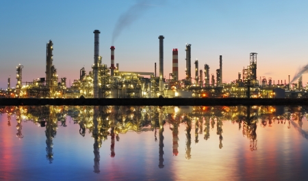 Oil and gas refinery at twilight with reflection - factory - petrochemical plantの写真素材