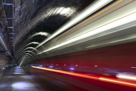 A tram disappearing into a tunnelの写真素材