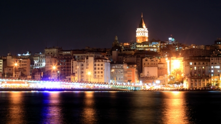 View of Istanbul and Galata tower and bridge at nightの写真素材