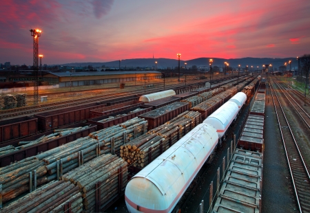 Cargo train platform at sunset with containerの写真素材