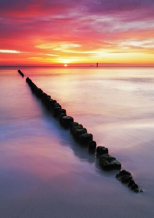 Baltic sea at beautiful sunrise in Poland beach の写真素材