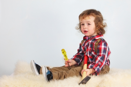 Cute child  holding hummer, studio shotの写真素材