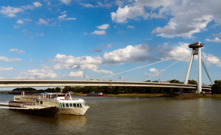New Bridge with ship, Bratislava, Slovakiaの写真素材