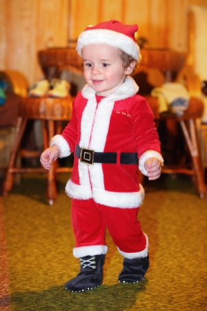 Cute kid in Santa Claus clothesの写真素材