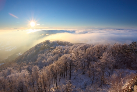 Winter sunset over the cloudsの写真素材