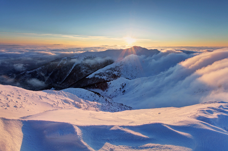 Winter sunset over the clouds.の写真素材