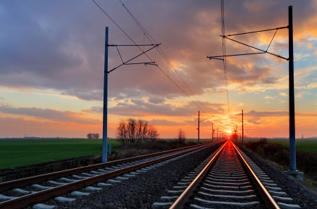 Railway, railroad at a nice dramatic sunsetの写真素材