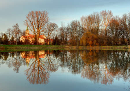 Church with reflection in pond, Ciferの写真素材
