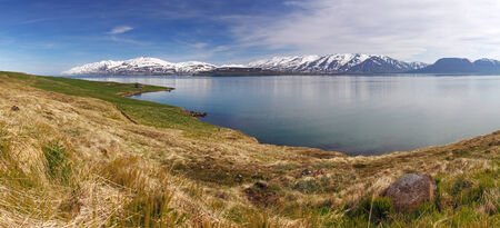 Iceland summer landscape. Fjord, house, mountains
