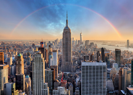 New York City skyline with urban skyscrapers and rainbow.の写真素材