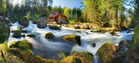 Austria panorama landscape with waterfall and watermill near Salzburg, Golling Alps