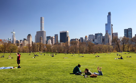 NEW YORK - APRIL 14: Views of the from the big meadow Central Park to Midtown New York on April 14, 2016. The Central Park is a famous Park in the centre of Manhattan, New York.のeditorial素材