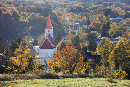 Church in Pernek, Slovakia village with forestの写真素材