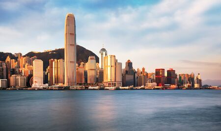 Hong Kong skyline at sunrise from kowloon side, Victoria harbourの写真素材