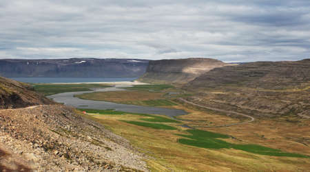 Mighty fjords rise from the sea in the Westfjords Peninsula, northwestern Icelandの写真素材