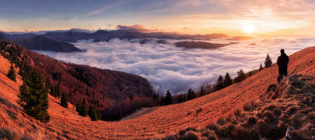 Morning sun panorama, beautiful fluffy clouds and forest at mount Lysec in Slovakia