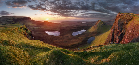 Panoramic view taken at The Quiraing on the Isle of Skye, Scotland, UK. Dramatic Scottish mountain landscapes with sunの写真素材
