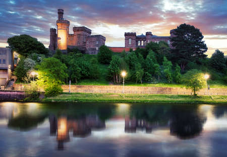 Scotland - Inverness skyline with castle reflection in Ness river at dramatic sunset, UKの写真素材