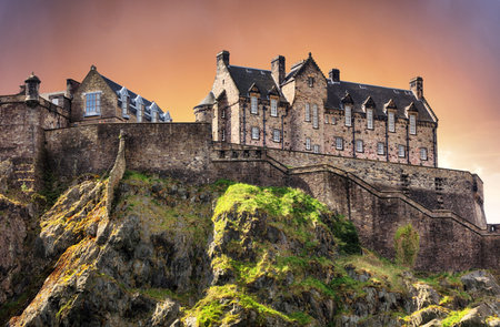 Scotland - Edinburgh Castle with green garden at dramatic sunset, UKのeditorial素材