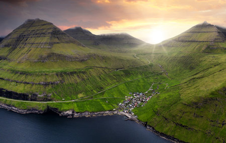 Sunset Aerial panorama of mountains and ocean around village of Funningur on Faroe Islands, Denmark landscapeの写真素材