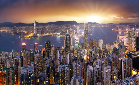 Hong Kong at dramatic sunset, China skyline - aerial viewの写真素材