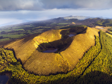 Azores - Aerial view of the volcanic mountains and lakes, with green farmland of Sete Cidades on Sao Miguel Island,  Portugalの写真素材