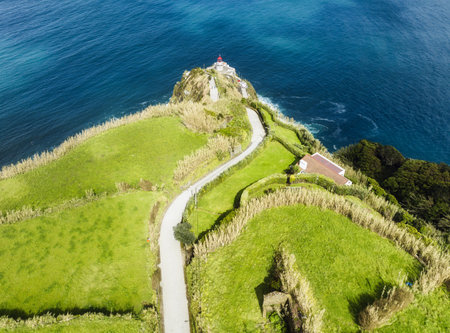 Farol do Arnel, Scenic Road, Beautiful Lighthouse on the Coast of Sao Miguel Island, Atlantic Ocean, Azores, Portugalの写真素材