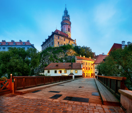 Cesky Krumlov with castle, old town and church at dramatic mist, Czech Republicの写真素材