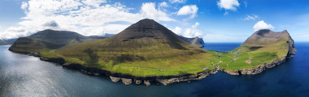 Aerial landscape photography. Amazing summer view from flying drone of Vidareidi village. Beautiful summer scenery. Sunny outdoor scene of Vidoy island, Faroe Islands, Denmark, Europe.の写真素材