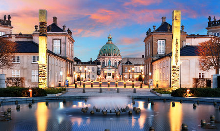 Copenhagen - Beautiful fountain at the Royal Danish Palace Amalienborg at dramatic sunrise. Royal residence, Denmarkの写真素材