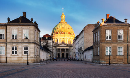 Sunrise view of Marmorkirken - Frederik's Church in Copenhagen - Amalienborg, Denmark. Captivating architecture with a majestic green dome and intricate details under a clear sky. Perfect for travel and histの写真素材