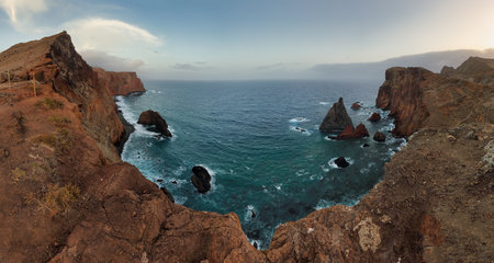 Nice ocean landscape - Dramatic sunrise over colorful cliffs of Ponta de Sao Lourenco in Madeira Island, Portugal.の写真素材