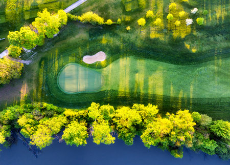 Aerial view drone shot of beautiful green golf field. Banner panorama backgroundの写真素材