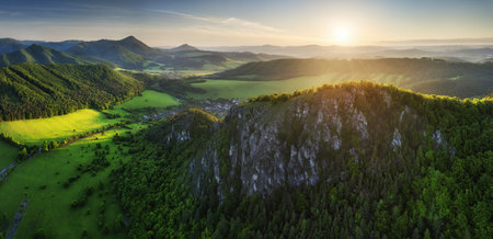 Panoramic view of a picturesque valley in the morning light, fog, meadows and morning light, spring rural landscapeの写真素材