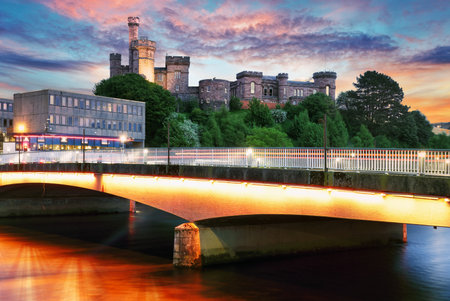 Scotland - Inverness skyline with castle reflection in Ness river at dramatic sunset, UKの写真素材