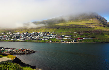 Klaksvik town with fjord and sunset sky, Bordoy island, Faroe islands, Denmark. Landscape photographyの写真素材