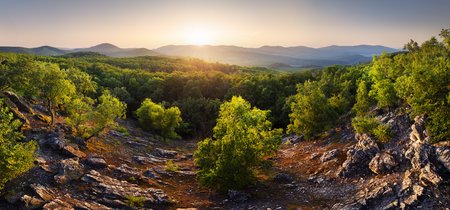 Amazing mountain landscape with colorful vivid sunset on the cloudy sky, natural outdoor travel background. Beauty worldの写真素材