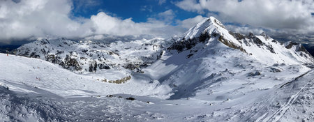 Beautiful view on snowy mountain range and ski slope in Austria Alps, Obertauern at winterの写真素材