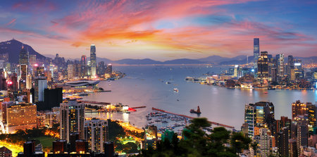 Hong Kong cityscape with skyscrapers at sunset, panoramaの写真素材