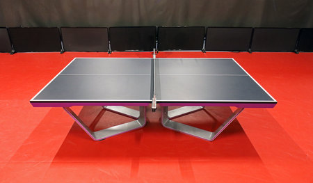 Table tennis black table with red floor from above. Indoor sports. Ping Pong Table. Healthy...