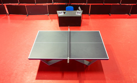 Table tennis black table with red floor from above. Indoor sports. Ping Pong Table. Healthy...