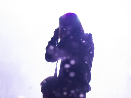 Girl photographer at the dance party on mans shouldersの写真素材