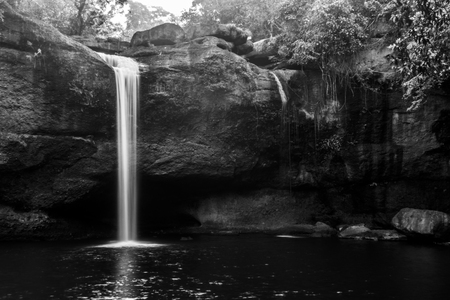 Beautiful waterfall with sunlight in jungle, Haew Suwat Waterfall. black and white shotの写真素材