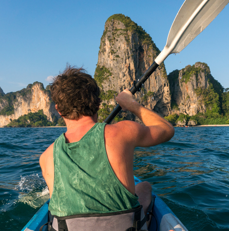 Kayaking around hight amazing Limestone Rocks at Railey Beach in Krabi, Thailand.の写真素材