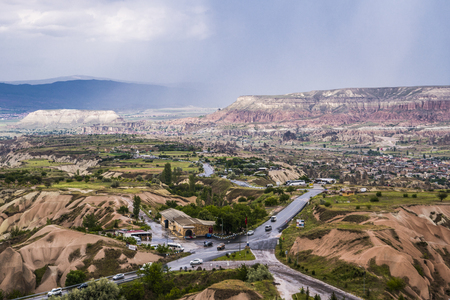 Travel Turkey - above view of Uchisar town and roads in valley in Nevsehir Province in Cappadocia in springの写真素材
