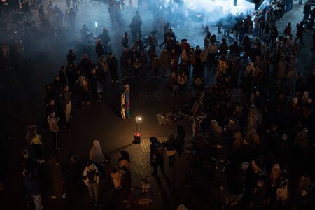 MOROCCO - MARRAKECH JAN 2019; Night view of Djemaa el Fna, a square and market place in Marrakeshs medina quarter. Street Berber Performanse in traditional wearのeditorial素材